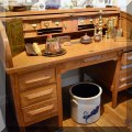 F75. Oak barrel top desk. 